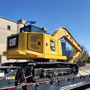 Excavatrice Caterpillar CAT310 d'occasion authentique, force de creusement équilibrée, stock disponible pour la consolidation des terres agricoles et l'extension des canaux - Product Image 1