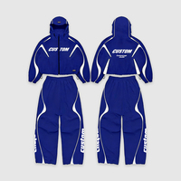 Ensemble de survêtement de jogging sportif personnalisé noir respirant à fermeture éclair avec bande réfléchissante coupe-vent en nylon pour hommes