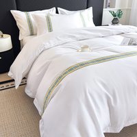 Parure de lit 4 pièces en coton 100% brodé blanc pur, style simple, pour hôtel 5 étoiles et gîte, comprenant housse de couette et drap.