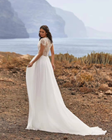 Robe de mariée coupe trapèze à manches longues et col en V, en dentelle