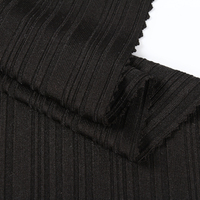 93% polyester 7% spandex couleur unie dty tissu côtelé tricot tissu côtelé irrégulier pour la fabrication de vêtements