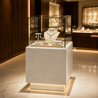 Vitrine de présentation de bijoux en verre carrée moderne avec base en pierre et éclairage LED pour magasin de bijoux