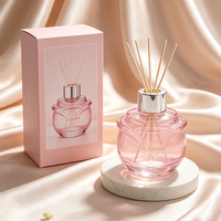 Diffuseur de parfum en verre avec motif floral élégant, flacon vide personnalisé coloré et boîte d'emballage sur mesure