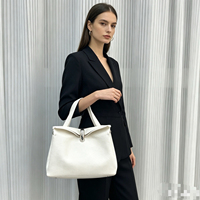 Sac à bandoulière pour femme au design de niche, en cuir de vachette de qualité supérieure, motif uni, forme oreiller, boucle métallique, léger