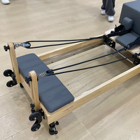 Reformer Pilates en chêne de qualité studio, pliable et réglable, équipement de fitness pour les jambes, vente en gros OEM