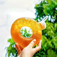 Vente en gros de bouteille en forme de beignet en plastique PP de 500ml avec bouchon à vis écologique pour boisson lait thé jus boissons gazeuses
