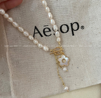 Biji nasi air segar mutiara kecil bunga aster kalung feminim jaring merah segar cangkang air collarbone desain rasa