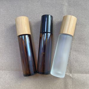 5ml 10ml <b>Glass</b> Roll <b>on</b> Bottle with Bamboo Lid Amber Frosted Refillable Essential Oil Bottle with Stainless Steel Roller Ball - Product Image 1