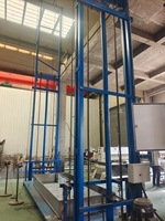 Plateforme élévatrice de chargement hydraulique Leopard SJD à rail de guidage, 1000 kg, 2 étages, pour atelier d'usine, montage mural avec enceinte de sécurité en treillis métallique