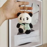 Vente en gros de jouets animaux en peluche panda mignon porte-clés en peluche doux jouets distributeur automatique de jouets mini porte-clés panda en peluche dessin animé Kawaii