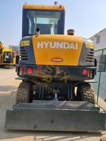Mini-excavatrice sur pneus d'occasion HYUNDAI 60W-7 6 tonnes, d'origine coréenne, fiable, bon prix, haute qualité, pour l'extraction aurifère, CE EPA TIER4 ROPS