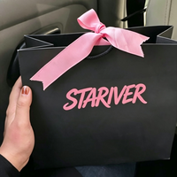Sac de shopping en papier noir style chic avec logo personnalisé, nœud décoratif, sac d'emballage cadeau pour cosmétiques et bijoux