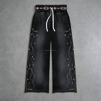Pantalon de survêtement vintage délavé et déchiré pour homme, coupe large, taille élastique, avec bords bruts et patchwork, style streetwear