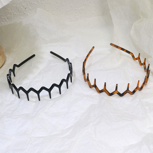 Vente en gros de peignes à cheveux bandeaux en plastique noir unisexe bandeaux à dents antidérapants pour femmes hommes filles - Product Image 1