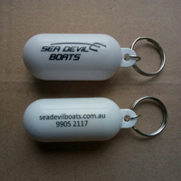 Porte-clés flottant créatif en forme de capsule, couleur unie, portable, avec logo OEM pour activités aquatiques en extérieur