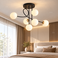 Lustre moderne noir à 6 globes en verre avec accents dorés et bras en forme de branche pour chambre, salle à manger, salon, hôtel
