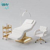 Lit de massage cosmétique électrique pour cils Table de massage spa de luxe Lit pour salon de beauté Mobilier d'esthéticienne Base dorée Lit incurvé pour le visage