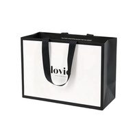 Sac en papier de luxe ivoire en carton robuste avec logo personnalisé pour vêtements