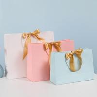 Sacs cadeaux de luxe avec nœud papillon pour l'emballage de bougies, vêtements, cosmétiques, sacs fourre-tout avec poignées torsadées, logo imprimé personnalisé