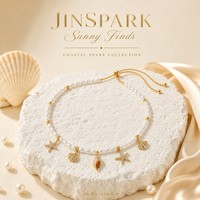 Collier tendance JinSpark avec pendentif perle étincelante, en acier inoxydable plaqué or, motif étoile de mer et coquillage, pour femme