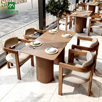Ensemble table et chaises en bois massif de style nordique, fauteuil durable adapté aux hôtels et restaurants commerciaux