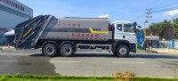 Camion poubelle compacteur Dongfeng HOWO haute capacité de 23 mètres cubes avec moteur-pompe : une efficacité inégalée pour les collecteurs de déchets urbains