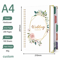 Carnet de planification de mariage OEM avec couverture blanche et motifs floraux, fabriqué par le fabricant