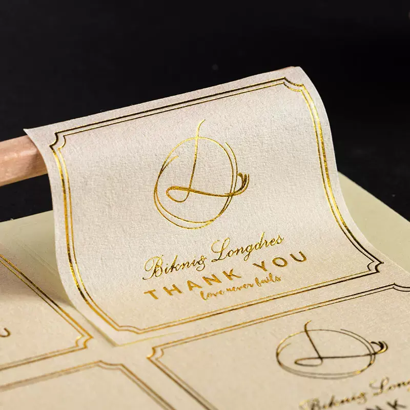 Özelleştirilmiş özel dokulu kağıt altın folyo sıcak damgalama lüks logo çıkartması ambalaj kağıdı sızdırmazlık çıkartmalar kutu ambalaj etiketleri