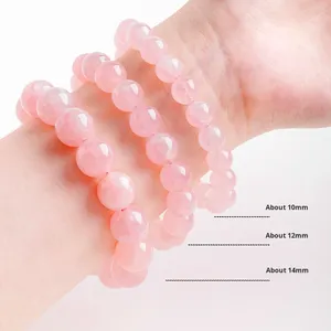 Bracelet en cristal de quartz rose naturel avec perles polies et breloque fleur de pêcher - Cadeau idéal pour une meilleure amie, cristal Feng Shui - Product Image 1