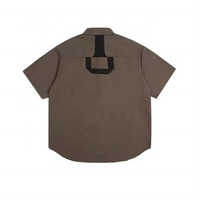 Chemises de travail pour hommes à col montant, manches courtes, coupe ample, boutonnées, style décontracté, motif uni brodé, tissu tricoté
