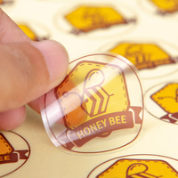 Impression d'autocollants en vinyle transparent imperméable personnalisés, étiquettes adhésives découpées au laser pour les emballages alimentaires, cosmétiques et bouteilles