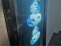 Panneau de film LED transparent flexible VORTEX pour affichage de fond en verre de stand d'exposition