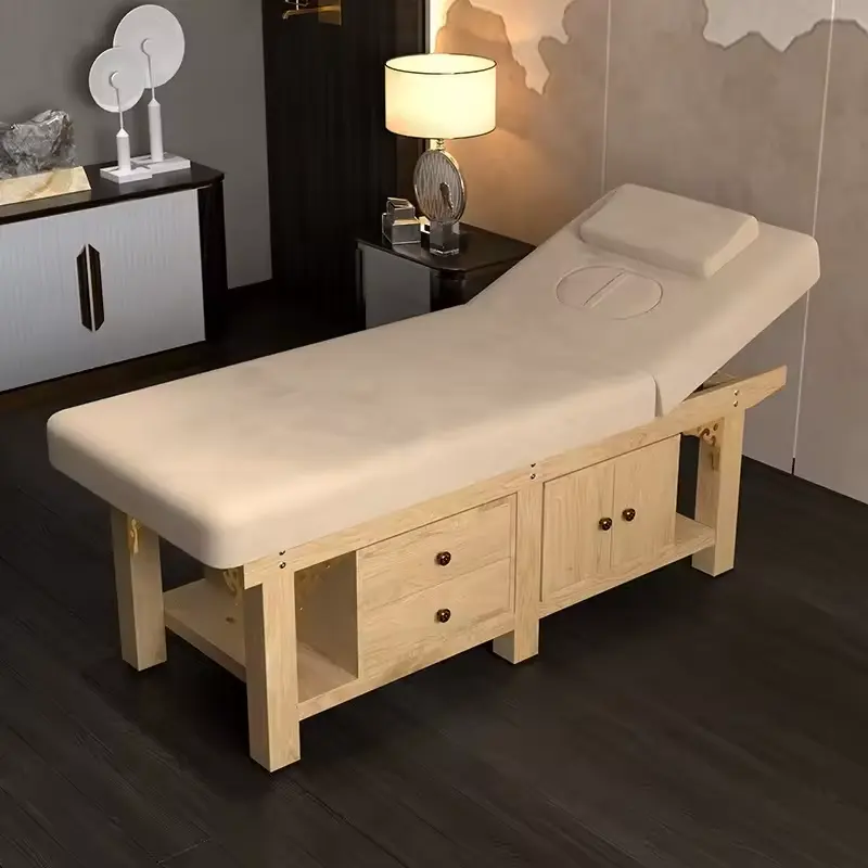 تصميم جديد سرير تدليك قابل للطي مناسب للاستخدام كصالون تجميل الوجه أو منتجع صحي للجسم مزود بإطار خشبي وخزانة للتخزين