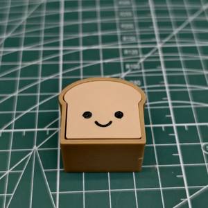 Juguete Antiestrés QY PLA con Forma de Pan Tostado de Dibujos Animados, con Teclado y Vibración Eléctrica - Product Image 4