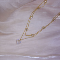 Accessoires de mode Double couche amour collier or diamant Zircon clavicule collier Niche Design tempérament collier pour les femmes