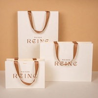 Sacs cadeaux élégants en papier mat avec logo personnalisé en feuille d'or rose, poignées en ruban de qualité supérieure, sacs de shopping pour l'emballage de la mode et des cosmétiques