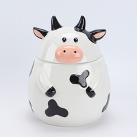 Adorable pot de rangement en céramique en forme de vache avec des taches noires et un nez rose pour ranger des biscuits, des bonbons ou de petits articles de cuisine