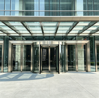 Porte tournante automatique à deux ailes, cadre en aluminium à économie d'énergie pour l'entrée des immeubles de bureaux