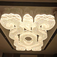 Lustre suspendu JYLIGHTING en cristal avec boucles entrelacées et cavités, idéal pour la rénovation complète des hôtels Andaz