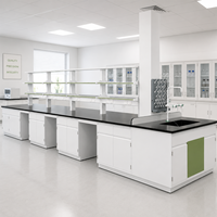 Custom Modular Island Laboratory Bench with Double Sided Reagent Shelves Sink and Movable Storage Cabinets for Chemistry Labs