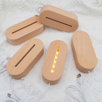 Vente en gros de boules de cristal 3D avec base de lampe de nuit LED à changement de couleur, alimentée par USB, design moderne, matériaux en bois et en cristal