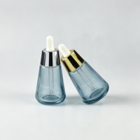 Flacon compte-gouttes en verre transparent pour huiles essentielles, nouveau design, 30 ml, 50 ml, flacon cosmétique en verre avec compte-gouttes en aluminium, vente chaude