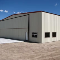 Entrepôt en structure acier préfabriquée sur mesure avec grandes portes coulissantes industrielles pour le stockage en vrac
