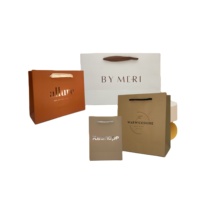 Magasin de vêtements de luxe personnalisé emballage de cadeau sacs de transport sacs à provisions avec propre logo