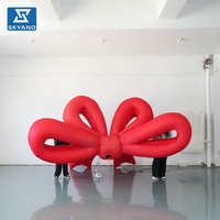 Modèle gonflable géant personnalisé en forme de nœud rouge suspendu pour les festivals, les fêtes, les vitrines de magasins, la publicité en extérieur, décoration gonflable