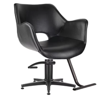 Fauteuil de coiffure moderne en similicuir noir ajouré, réglable en hauteur par vérin hydraulique et pivotant à 360°