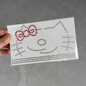 Pegatinas de tatuaje facial de Hello Kitty transfronterizas, hechas a mano con diamantes de imitación, maquillaje de Año Nuevo, decoraciones de diamantes de imitación con purpurina en tarjeta blanca. - Product Image 4