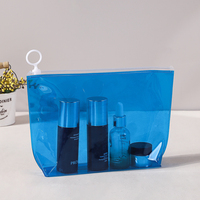 Sac de voyage transparent en PVC personnalisé avec fermeture éclair supérieure, poignée à boucle, impression bronzée durable, léger et étanche pour le rangement