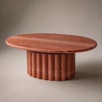 Table à manger ovale en travertin rouge avec piétement cannelé, meuble en pierre naturelle