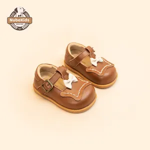 Sapatos de princesa de cor sólida personalizados de estilo simples e elegante para bebês com sola macia e laço de nó
